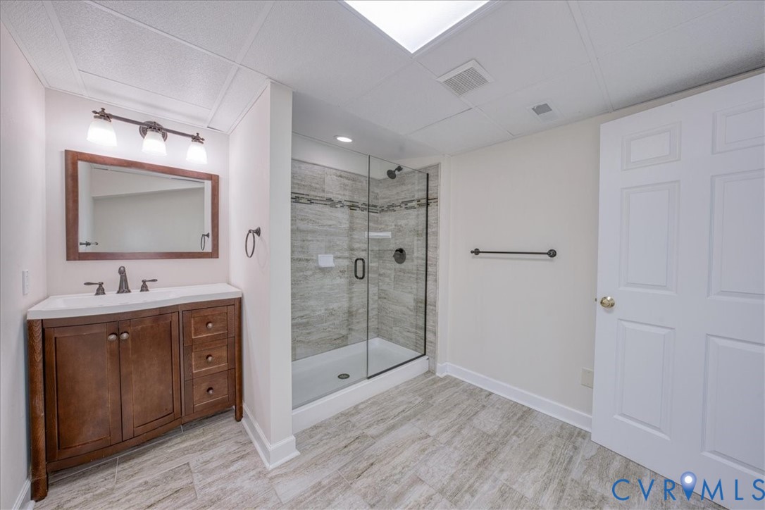 1813 Gildenborough Court Midlothian, VA 23113 - Photo 40 of 46 a bathroom with a double vanity sink mirror and shower