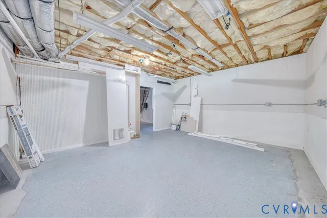 a view of a hallway with wooden floor and entryway