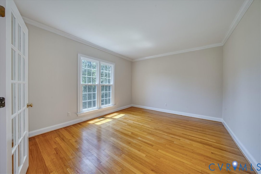1813 Gildenborough Court Midlothian, VA 23113 - Photo 5 of 46 a view of an empty room with wooden floor and a window