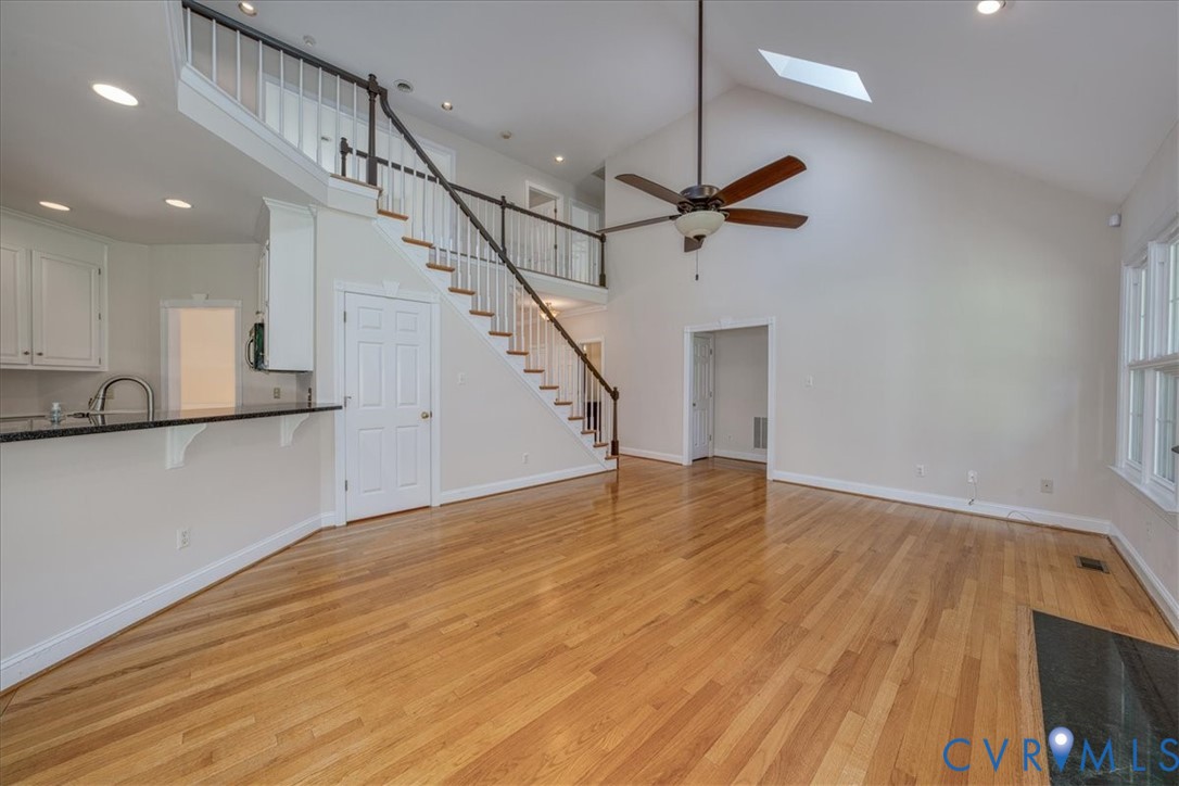 1813 Gildenborough Court Midlothian, VA 23113 - Photo 8 of 46 a view of an empty room with wooden floor and a ceiling fan