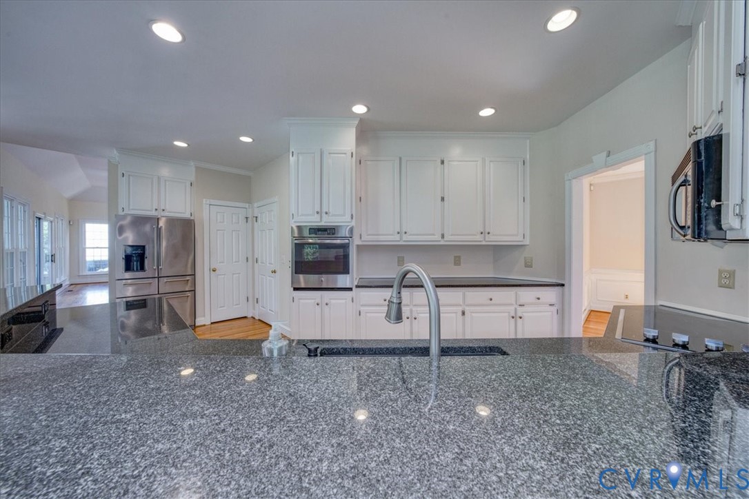 1813 Gildenborough Court Midlothian, VA 23113 - Photo 9 of 46 a kitchen with stainless steel appliances a refrigerator sink and stove