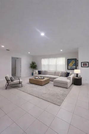 a living room with furniture and a table