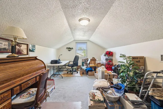 a bedroom with furniture and a chandelier