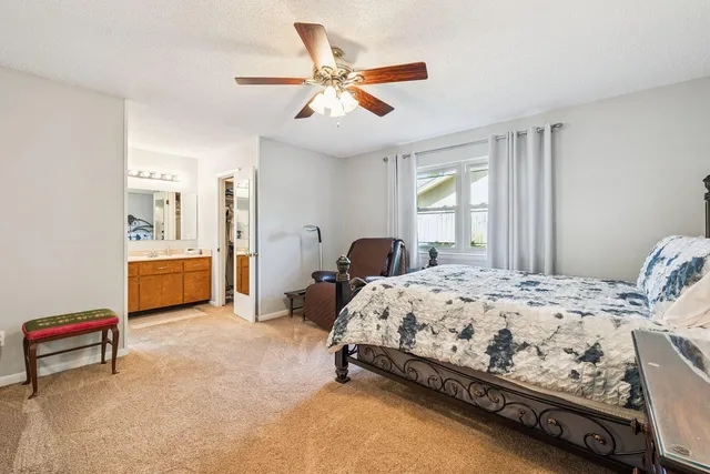 a bedroom with bed and window