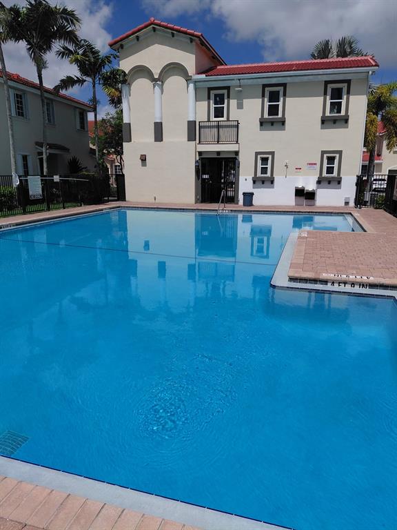 21205 Northwest 14th Place, Unit 319 Miami, FL 33169 - Photo 2 of 14 a house view with a outdoor space