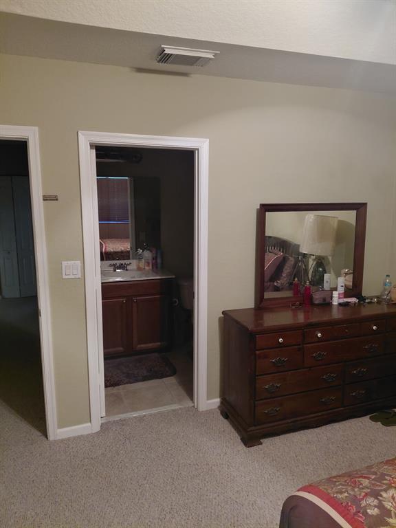 21205 Northwest 14th Place, Unit 319 Miami, FL 33169 - Photo 9 of 14 a view of room with furniture and cabinet