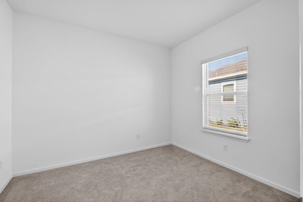 210 White Rabbit Run St. Augustine, FL 32092 - Photo 44 of 85 an empty room with windows