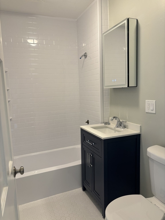 63 Callender Street, Unit 3R Boston, MA 02124 - Photo 18 of 24 a bathroom with a sink toilet and vanity