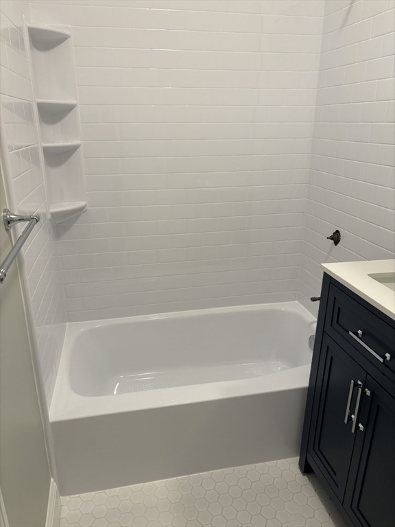 63 Callender Street, Unit 3R Boston, MA 02124 - Photo 19 of 24 a bathroom with bathtub
