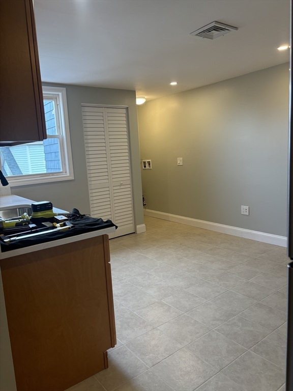 63 Callender Street, Unit 3R Boston, MA 02124 - Photo 7 of 24 a view of a livingroom with a staircase