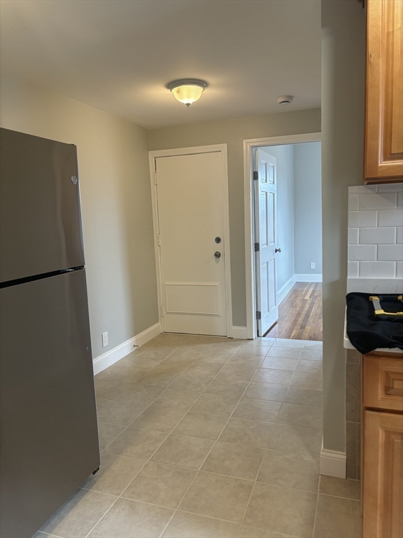 63 Callender Street, Unit 3R Boston, MA 02124 - Photo 9 of 24 a view of a kitchen and closet area