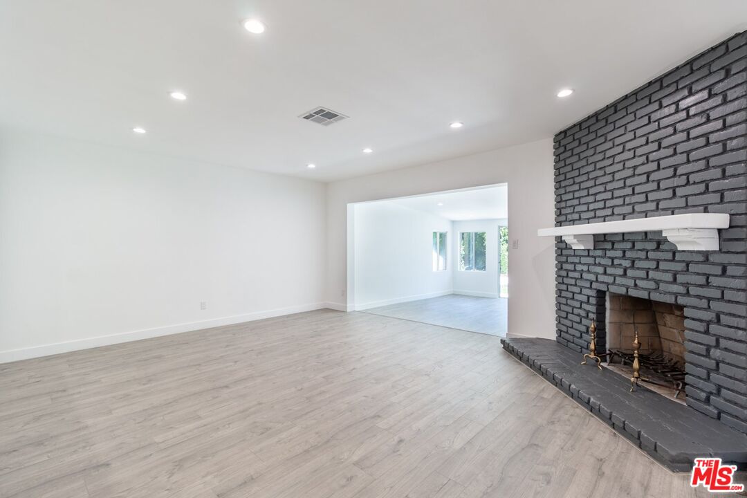 9416 Ruffner Avenue Northridge, CA 91343 - Photo 2 of 27 a view of an empty room with a fireplace