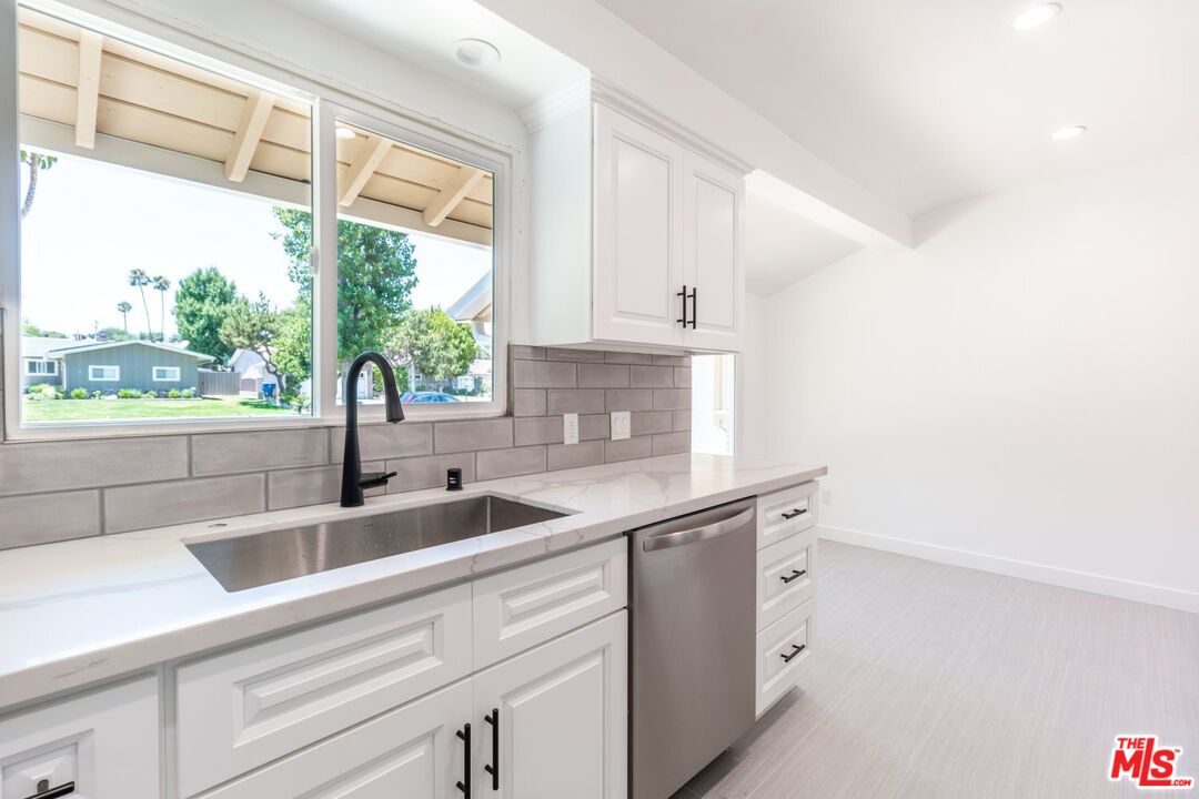 9416 Ruffner Avenue Northridge, CA 91343 - Photo 24 of 27 a kitchen with a sink and large window