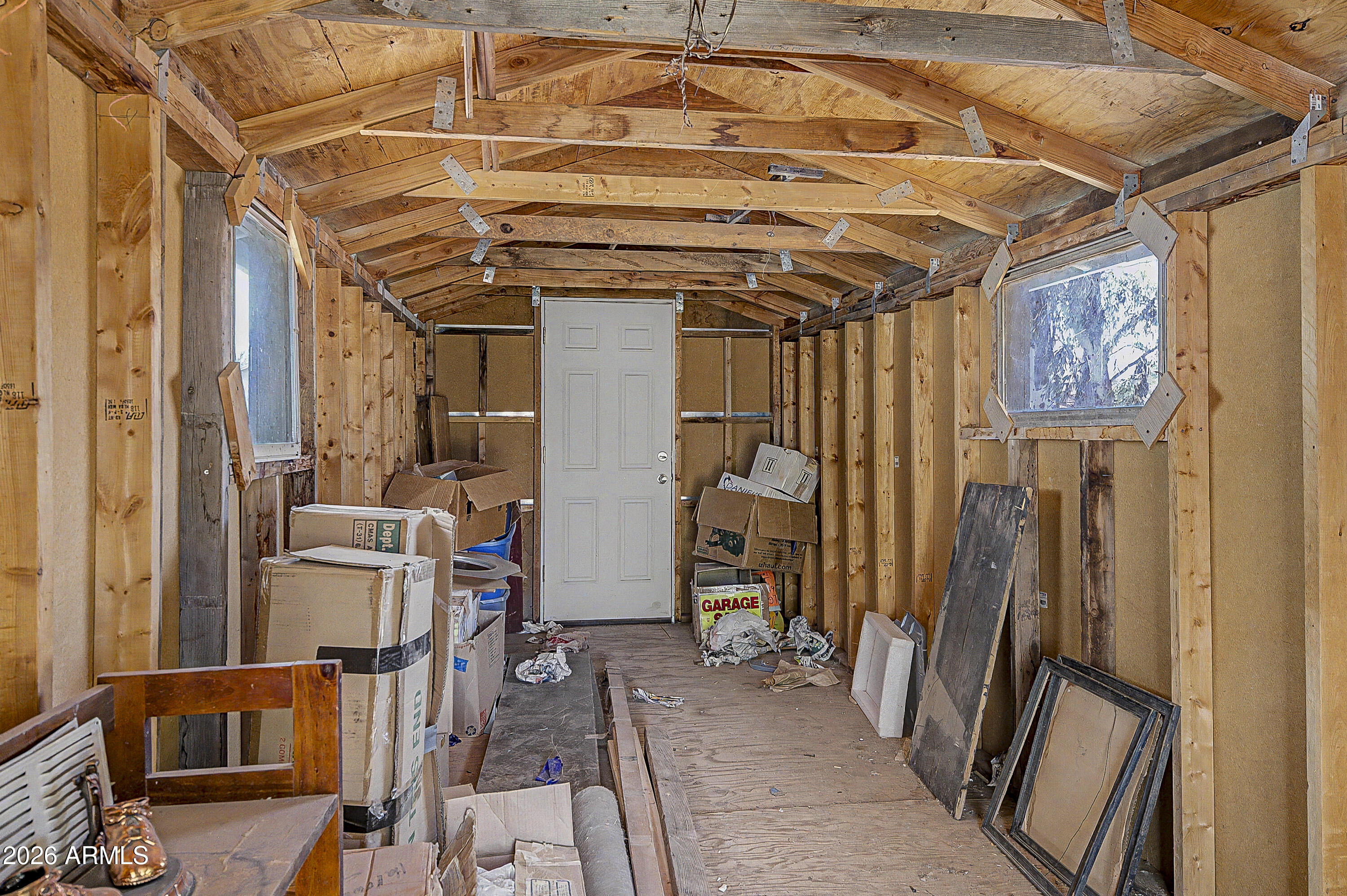 633 Oasis Road Camp Verde, AZ 86322 - Photo 20 of 50 a view of an empty room with wooden floor