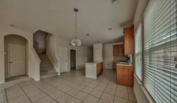 a view of a hallway with seating area