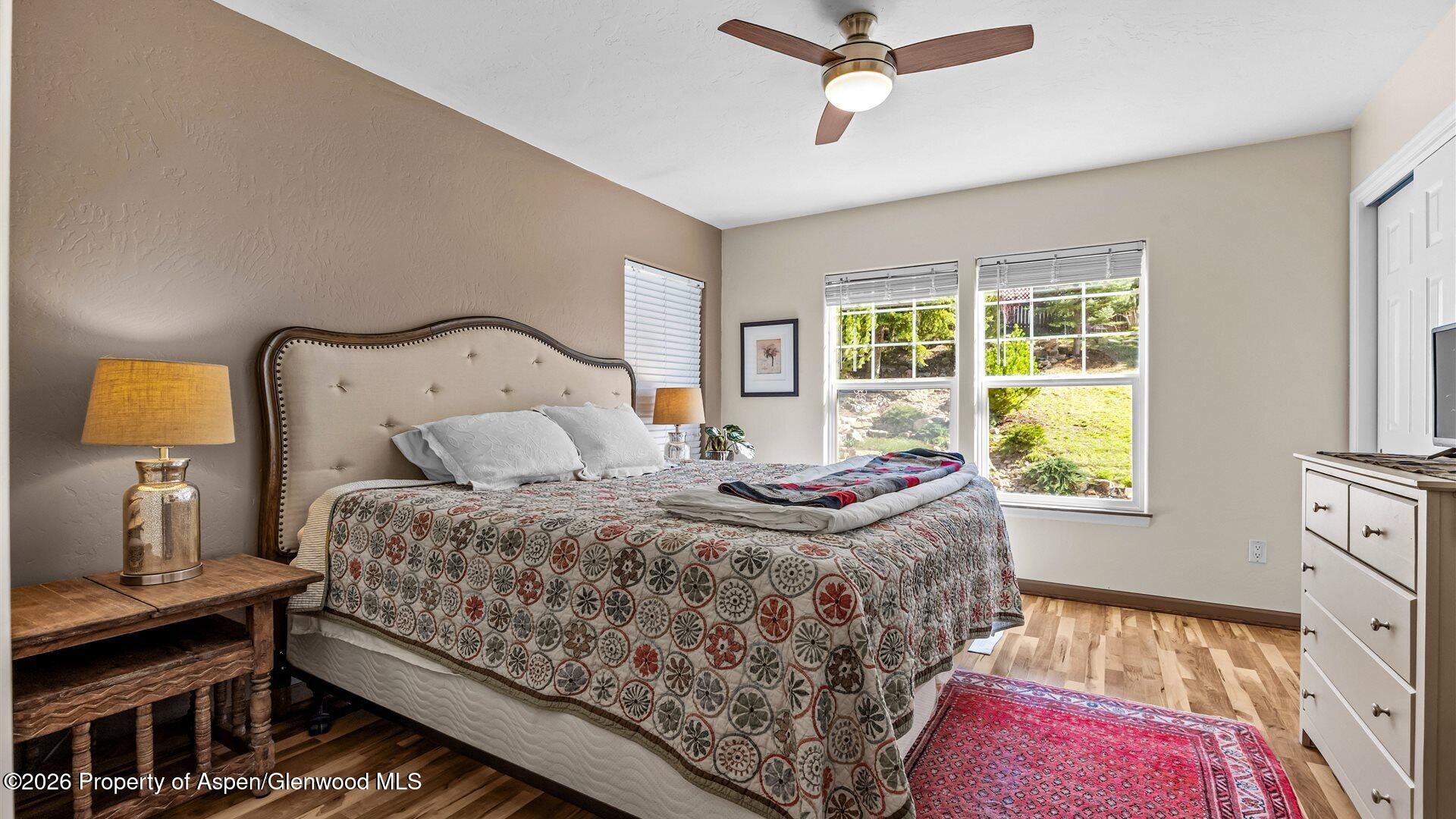 606 Lariat Loop New Castle, CO 81647 - Photo 12 of 27 a bedroom with a bed and window