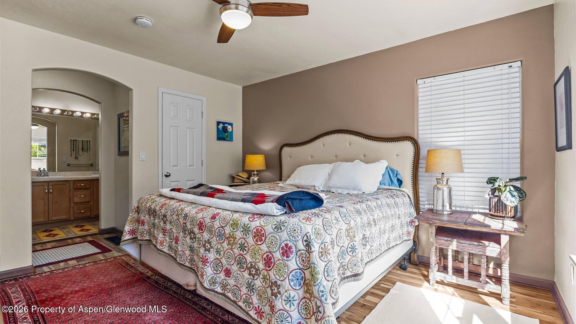 606 Lariat Loop New Castle, CO 81647 - Photo 13 of 27 a bedroom with a bed and dresser with mirror