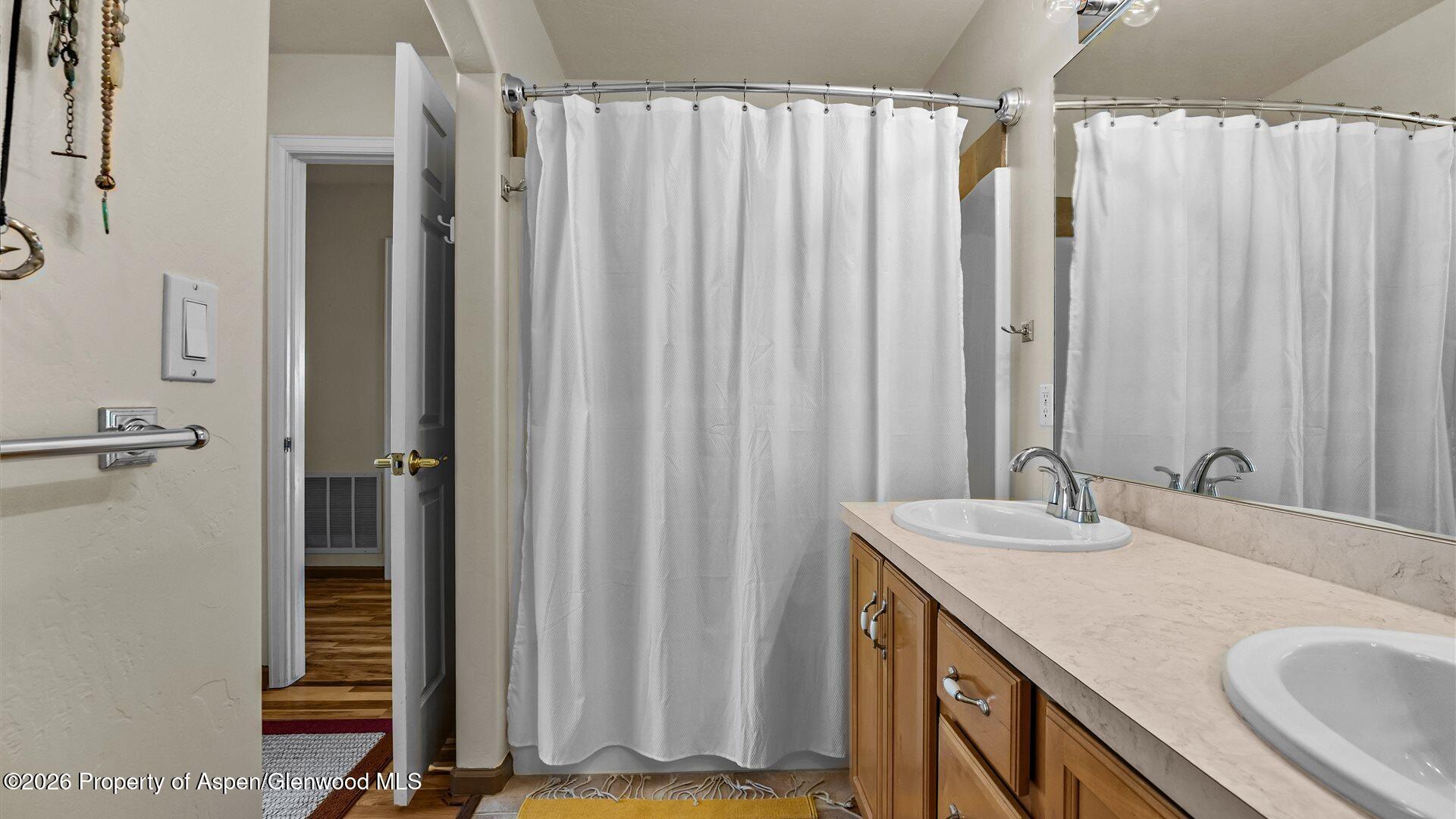 606 Lariat Loop New Castle, CO 81647 - Photo 15 of 27 a bathroom with a granite countertop sink and a mirror