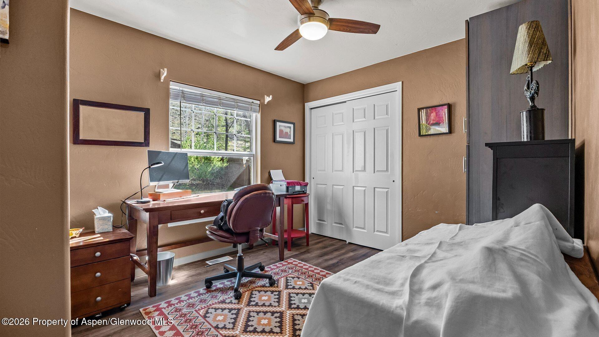 606 Lariat Loop New Castle, CO 81647 - Photo 16 of 27 a bedroom that has a bed and a desk in it