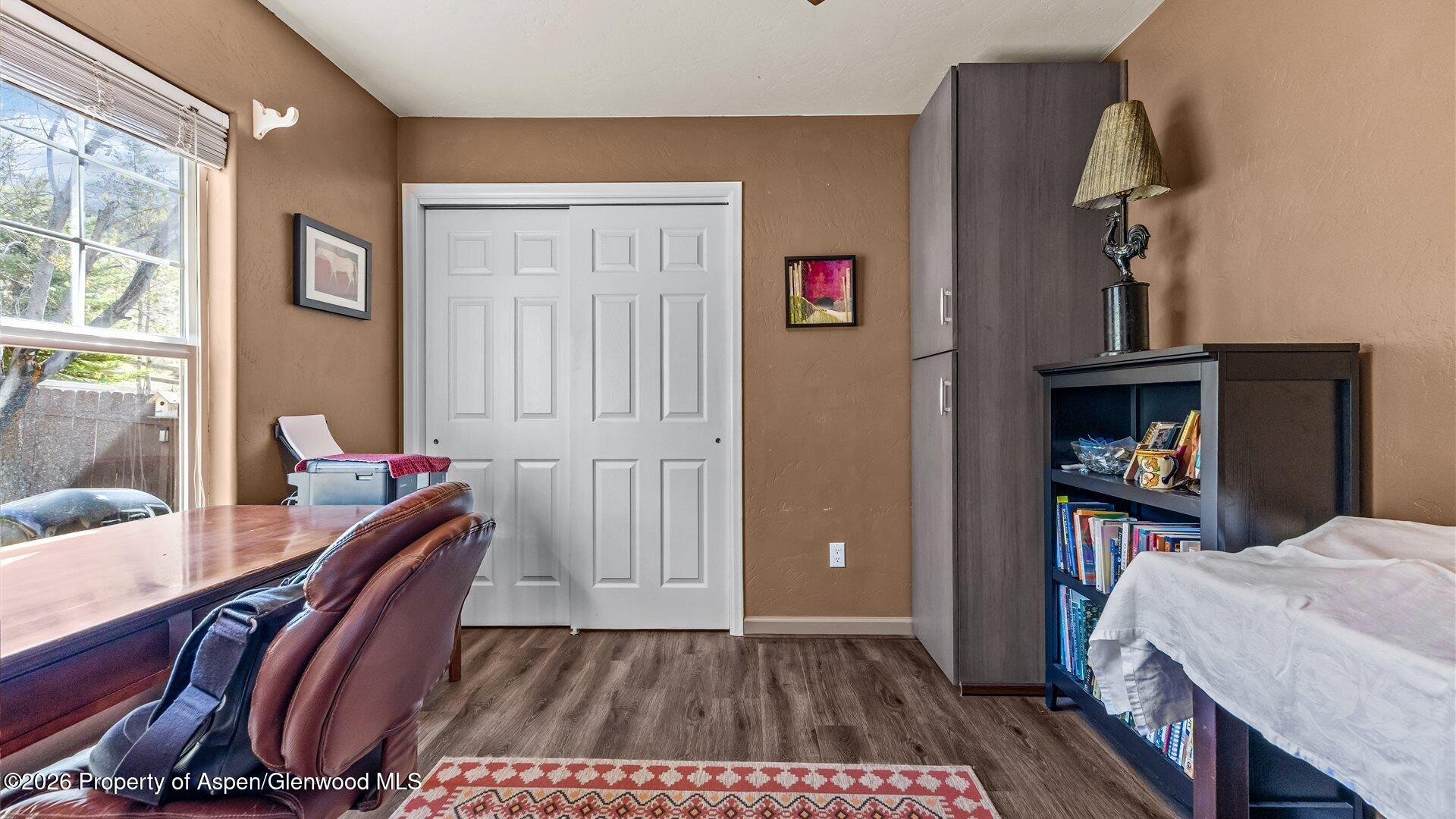 606 Lariat Loop New Castle, CO 81647 - Photo 17 of 27 a view of a bedroom with furniture and a window