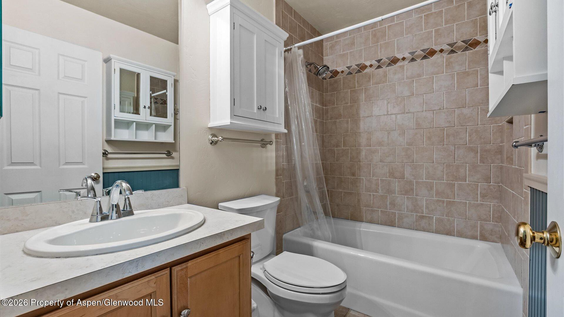 606 Lariat Loop New Castle, CO 81647 - Photo 18 of 27 a bathroom with a sink toilet and shower
