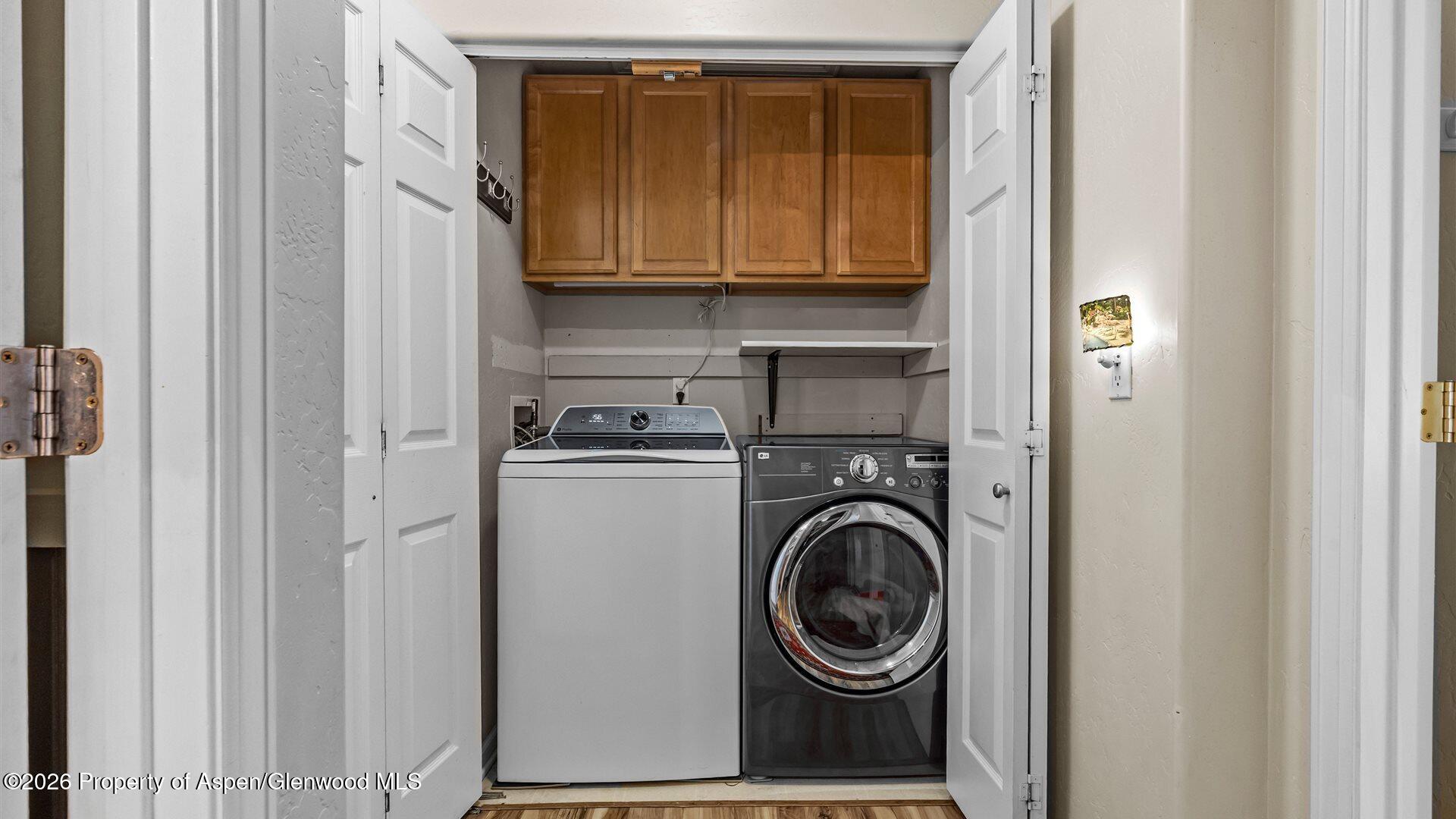 606 Lariat Loop New Castle, CO 81647 - Photo 19 of 27 a utility room with dryer and washer