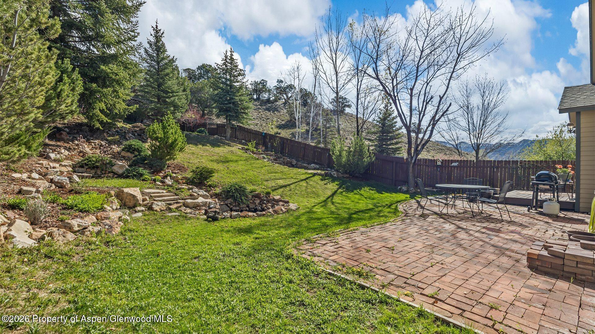 606 Lariat Loop New Castle, CO 81647 - Photo 22 of 27 a view of a backyard with large trees