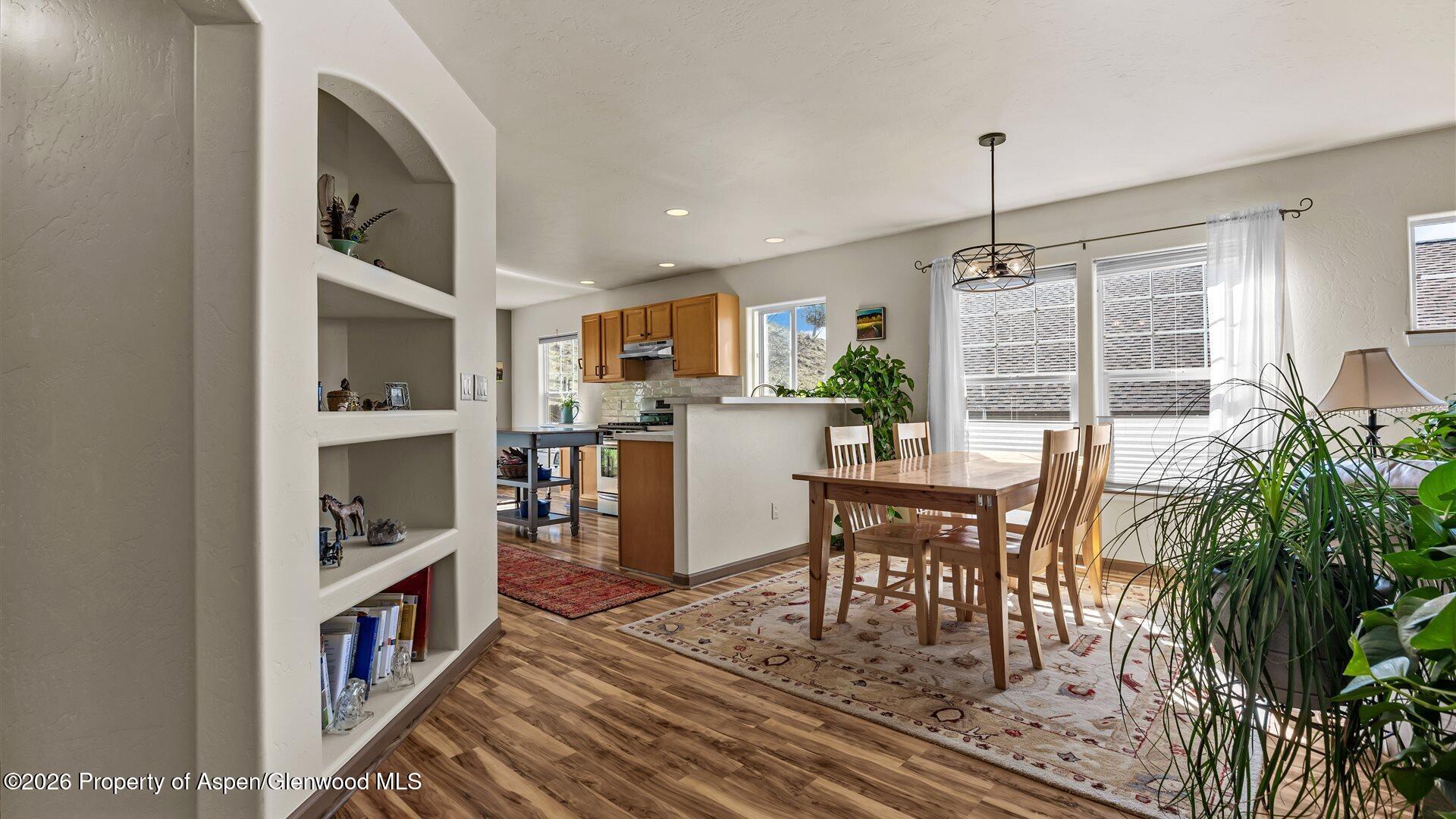 606 Lariat Loop New Castle, CO 81647 - Photo 6 of 27 a living room with furniture and a book shelf
