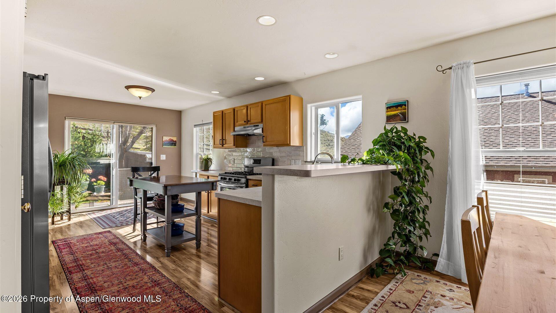 606 Lariat Loop New Castle, CO 81647 - Photo 7 of 27 a room with furniture a potted plant and open kitchen view