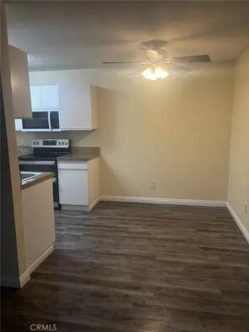 a view of kitchen with wooden floor