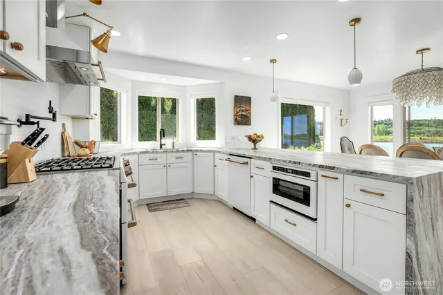 a kitchen with a sink stove and cabinets