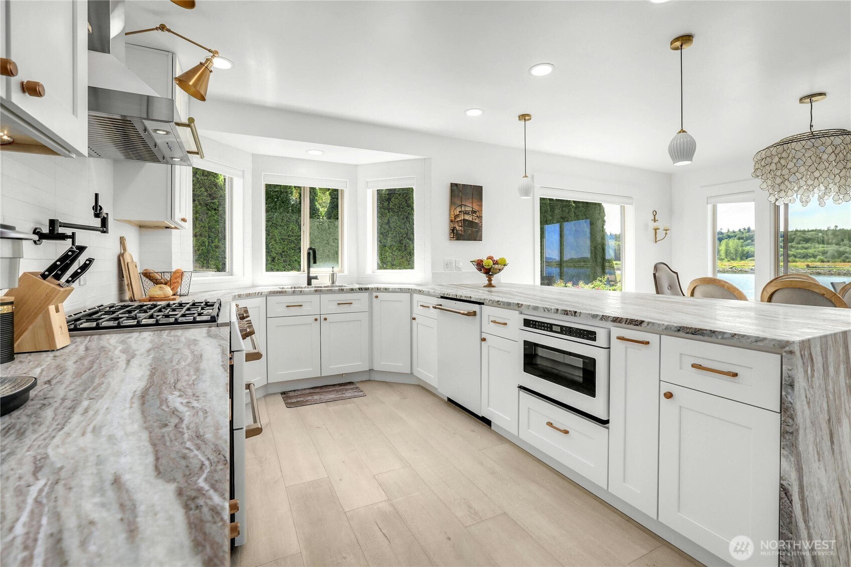 14938 Channel Lane La Conner, WA 98257 - Photo 13 of 40 a kitchen with a sink stove and cabinets