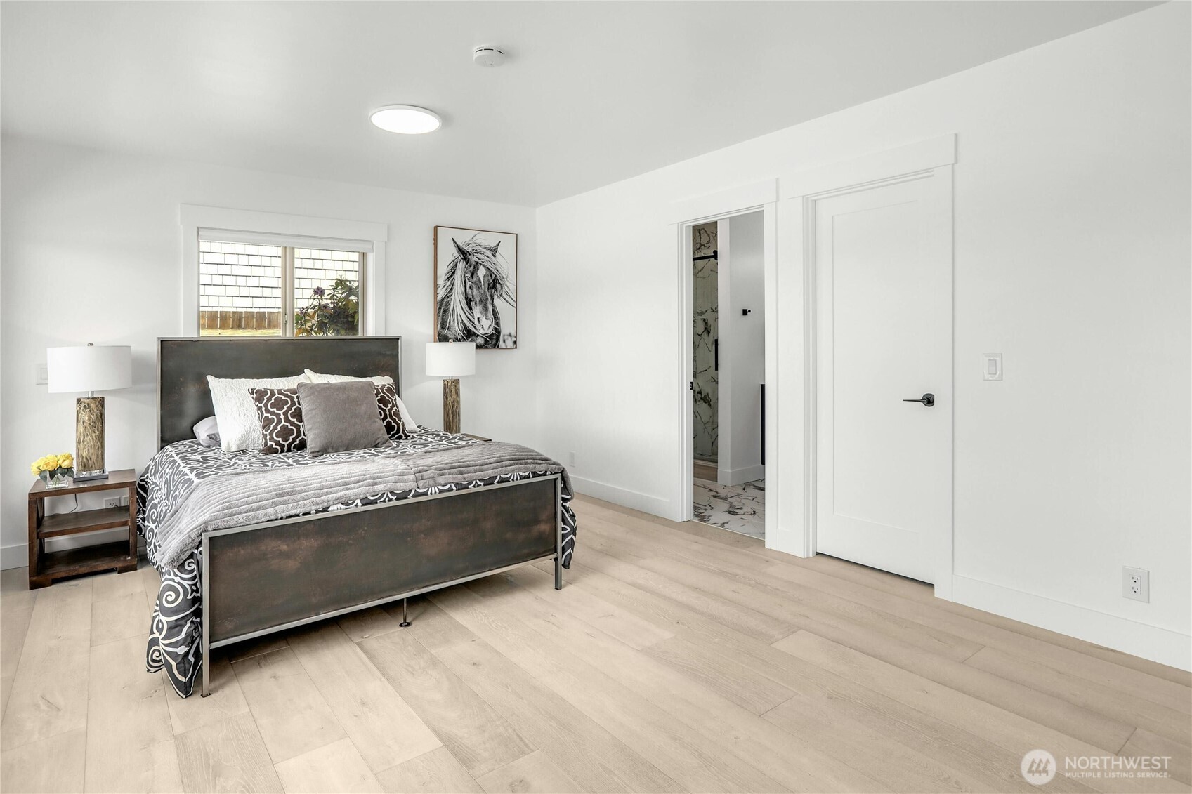 14938 Channel Lane La Conner, WA 98257 - Photo 15 of 40 a spacious bedroom with a bed and window