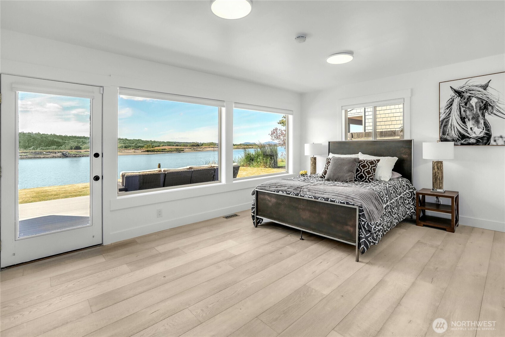 14938 Channel Lane La Conner, WA 98257 - Photo 16 of 40 a bedroom with a bed and a large window