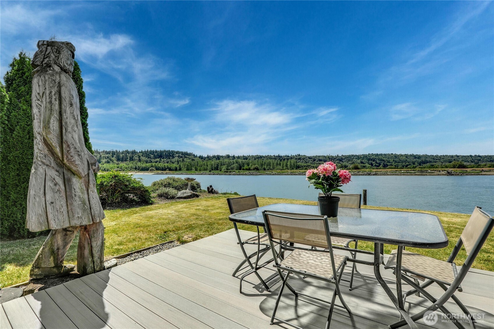 14938 Channel Lane La Conner, WA 98257 - Photo 2 of 40 a view of a chairs and table in patio with a lake view