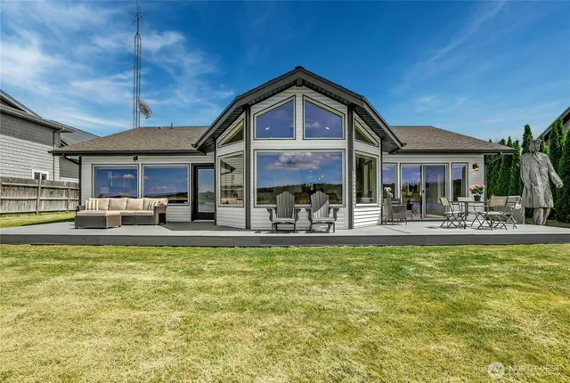 a view of a swimming pool with outdoor seating