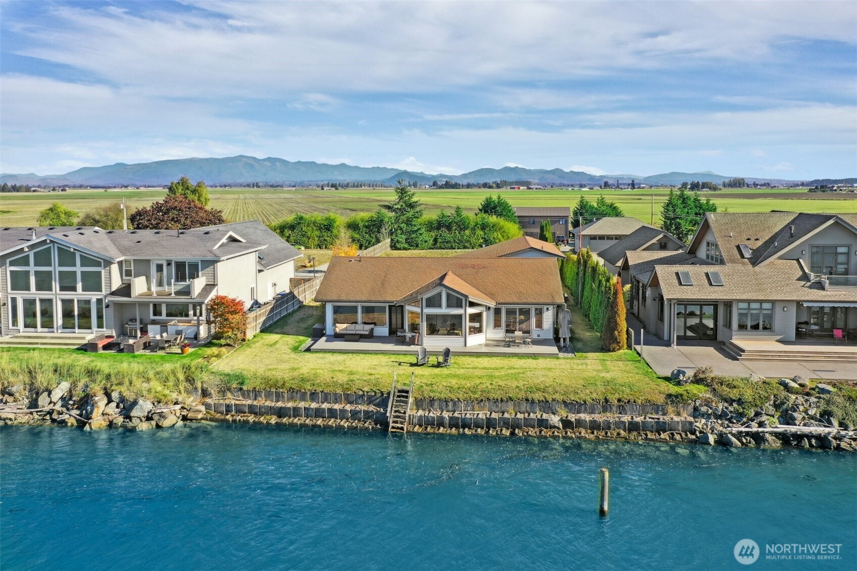 14938 Channel Lane La Conner, WA 98257 - Photo 37 of 40 a front view of a house with a garden