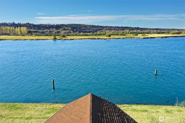a view of a swimming pool and an outdoor seating