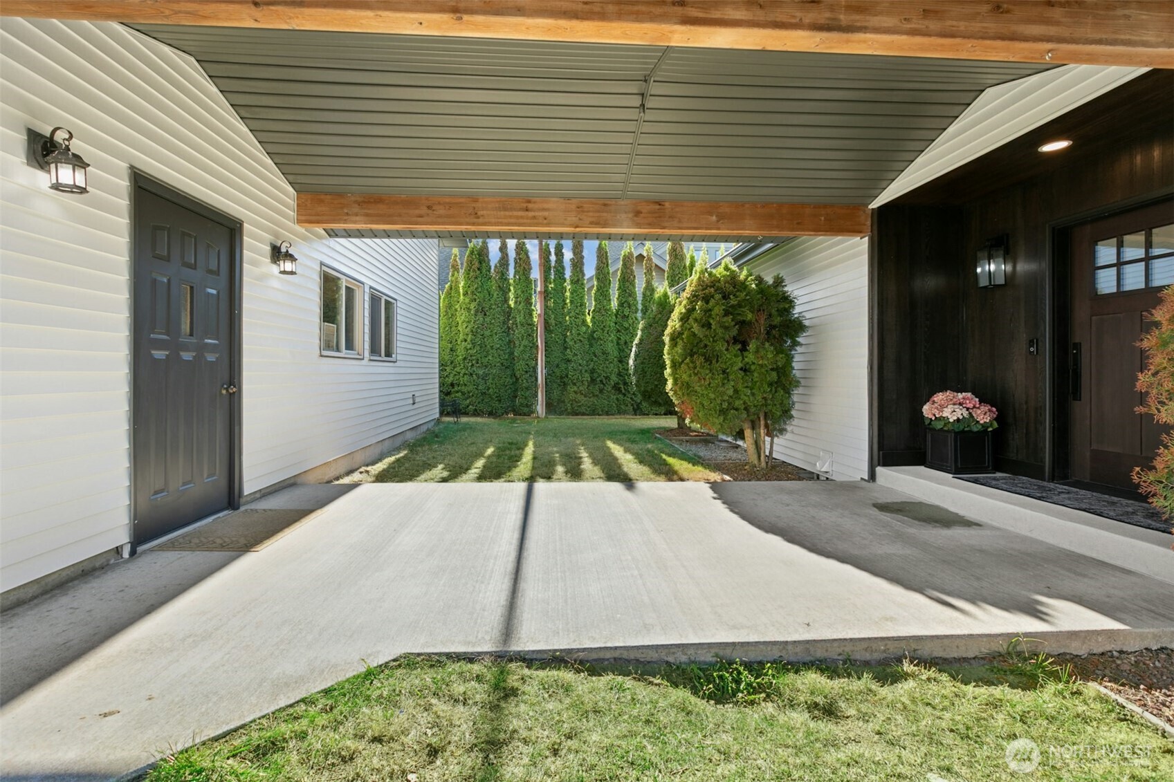 14938 Channel Lane La Conner, WA 98257 - Photo 5 of 40 a white house with a yard and potted plants
