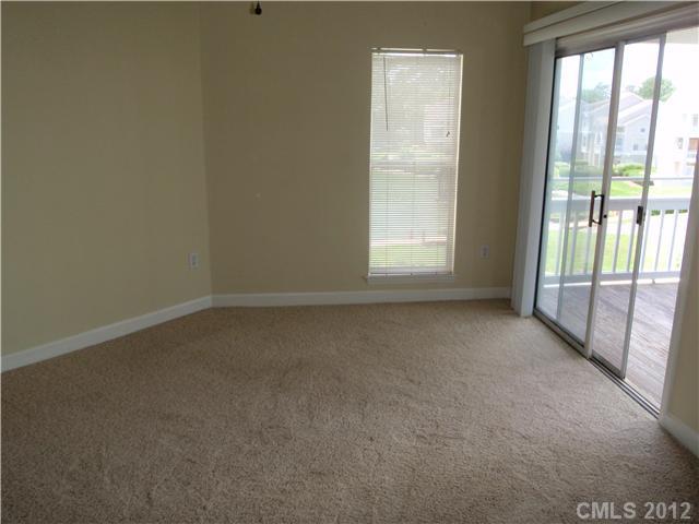 1133 Torrence Circle, Unit 1133 Davidson, NC 28036 - Photo 5 of 11 an empty room with a window