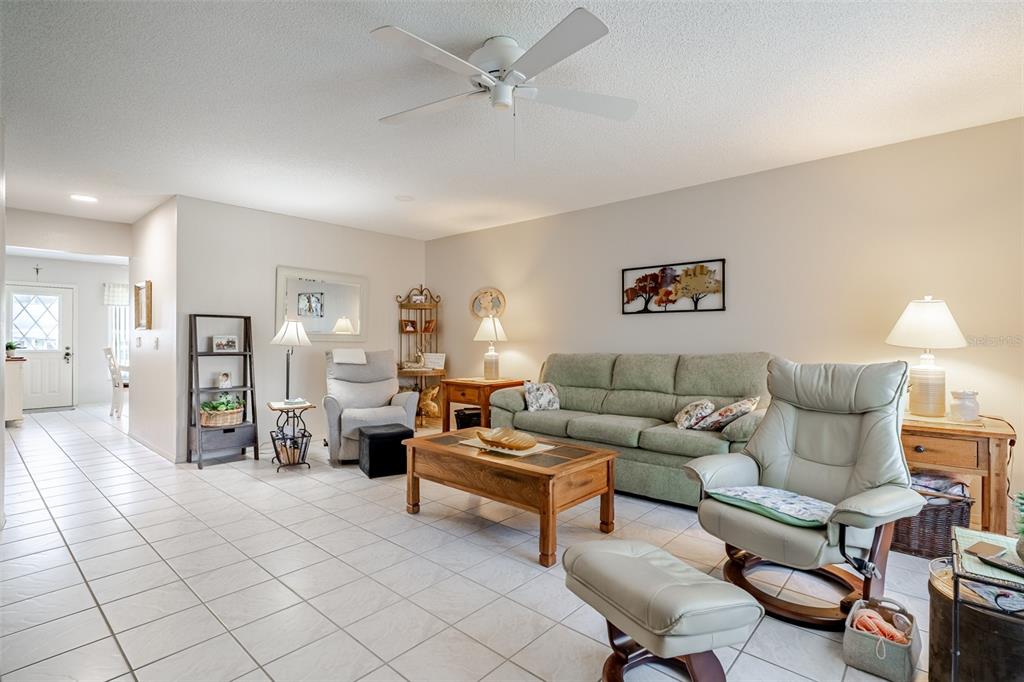 2296 Monaco Lane, Unit 8 Clearwater, FL 33763 - Photo 2 of 28 a living room with furniture and wooden floor