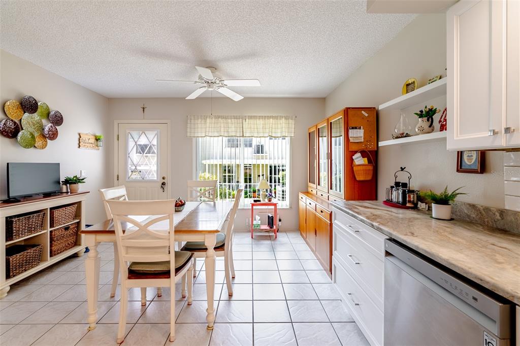 2296 Monaco Lane, Unit 8 Clearwater, FL 33763 - Photo 4 of 28 a large kitchen with a large counter space appliances and furniture