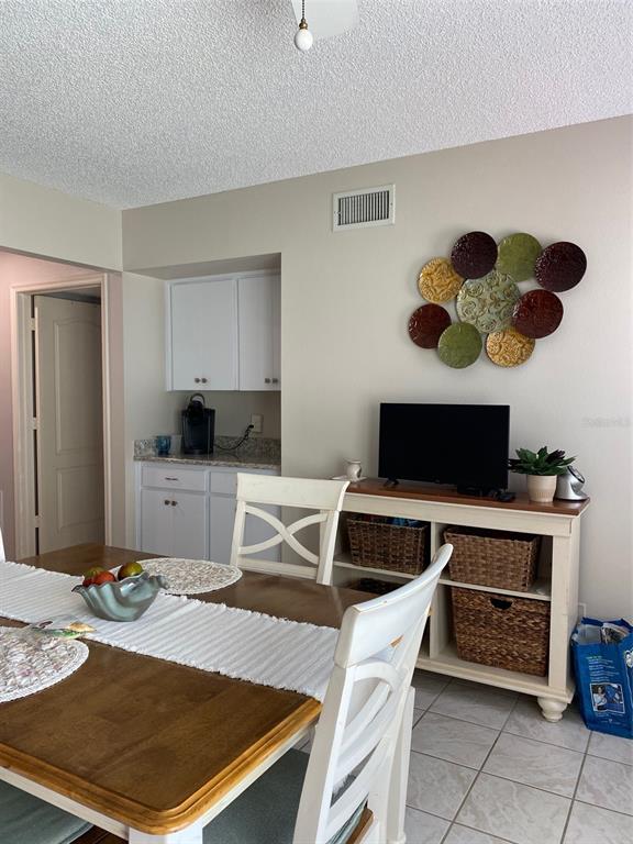2296 Monaco Lane, Unit 8 Clearwater, FL 33763 - Photo 10 of 28 a living room with a couch and a coffee table