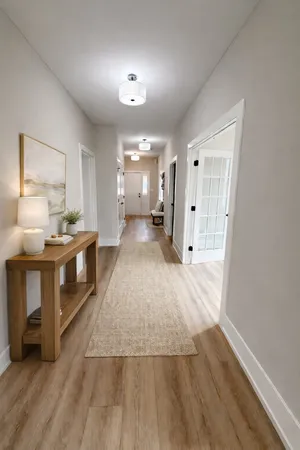 a large white kitchen with a large window
