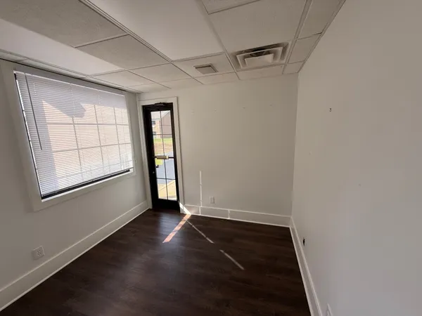 a room with a table and chairs