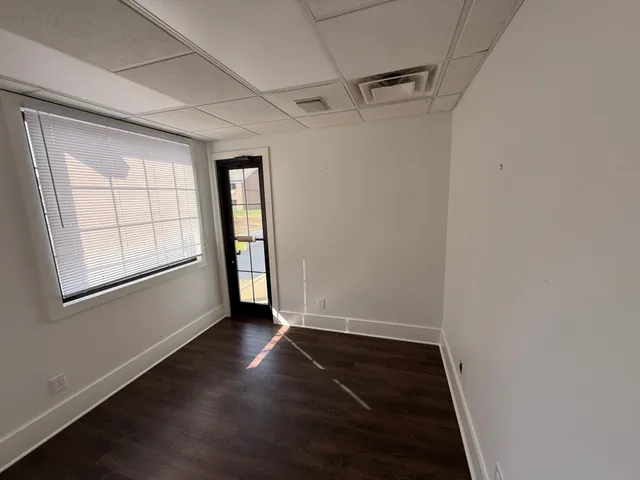 a room with a table and chairs