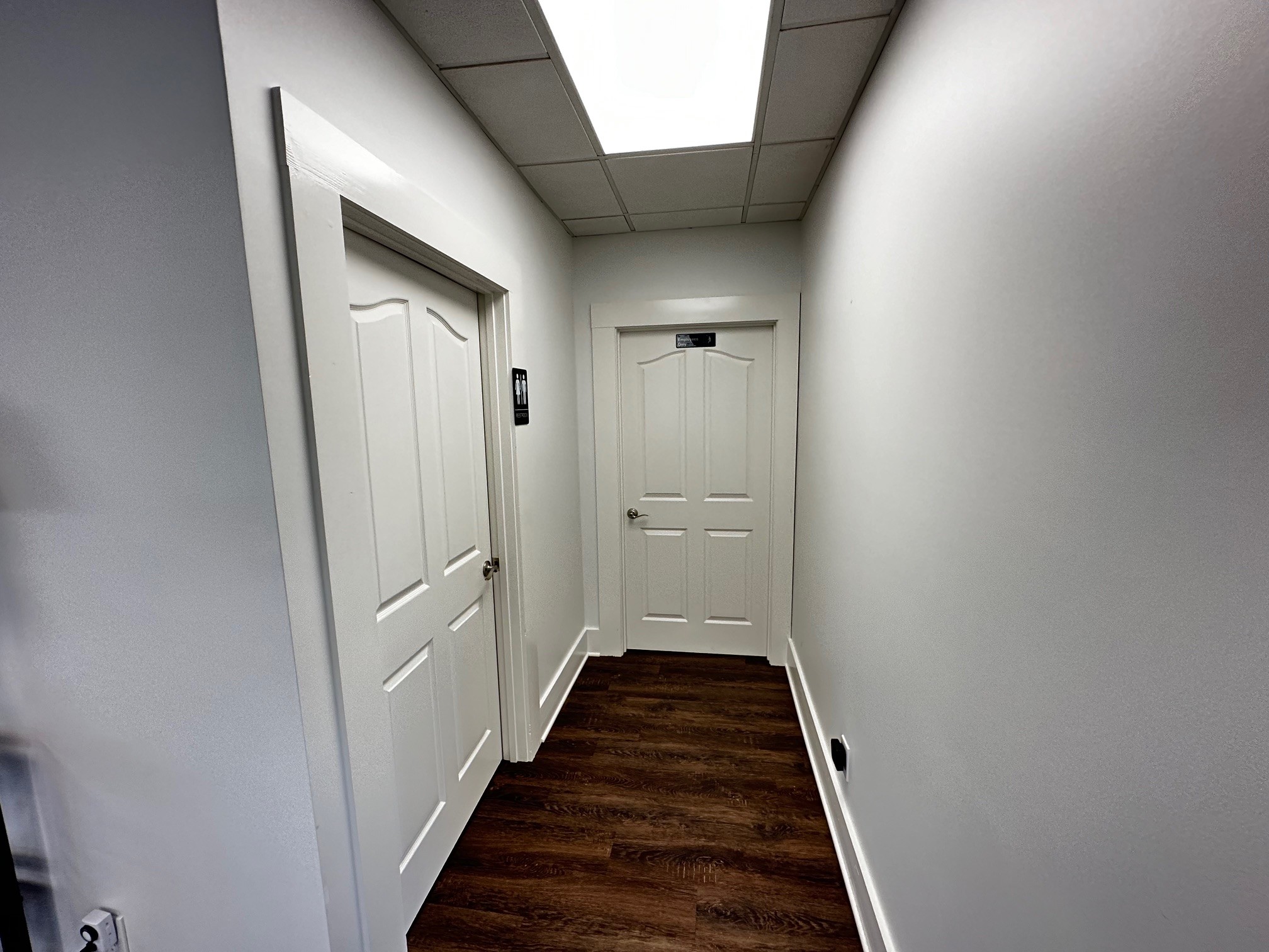 2007 West Everly Brothers Boulevard Powderly, KY 42367 - Photo 17 of 22 a view of a hallway with wooden floor and staircase