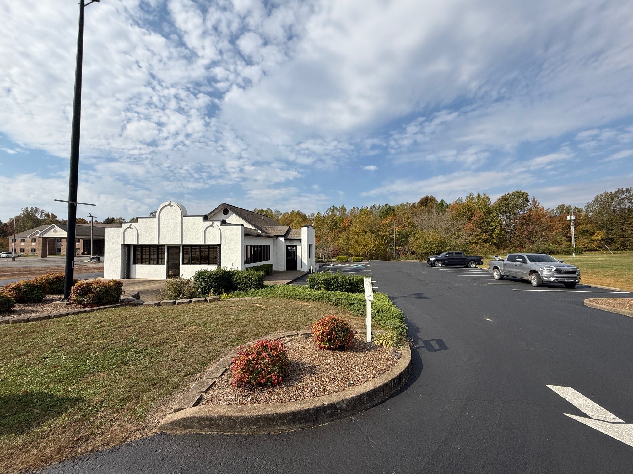 2007 West Everly Brothers Boulevard Powderly, KY 42367 - Photo 2 of 22 a front view of a house with a yard