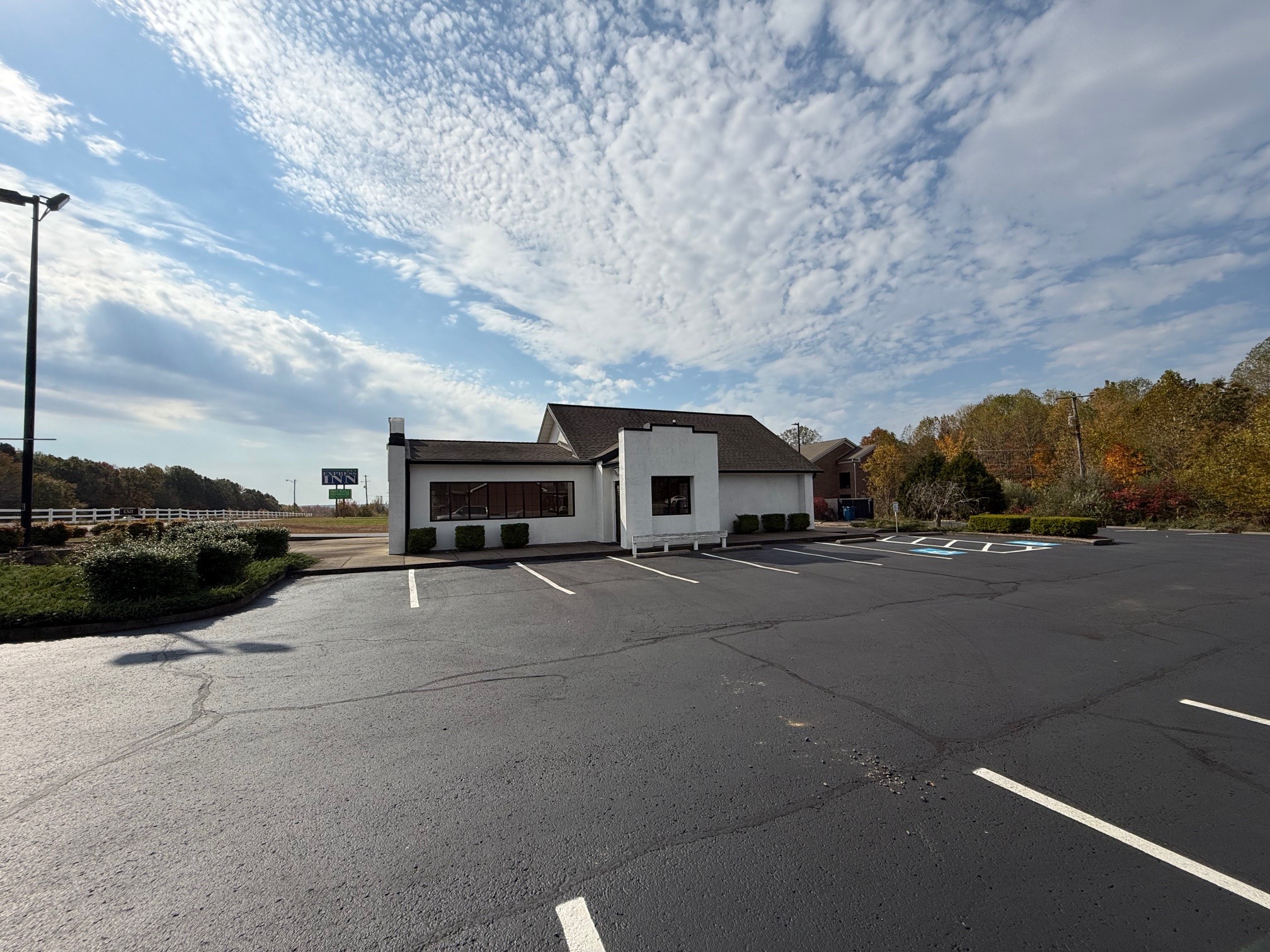 2007 West Everly Brothers Boulevard Powderly, KY 42367 - Photo 3 of 22 a couple of cars parked in front of a building