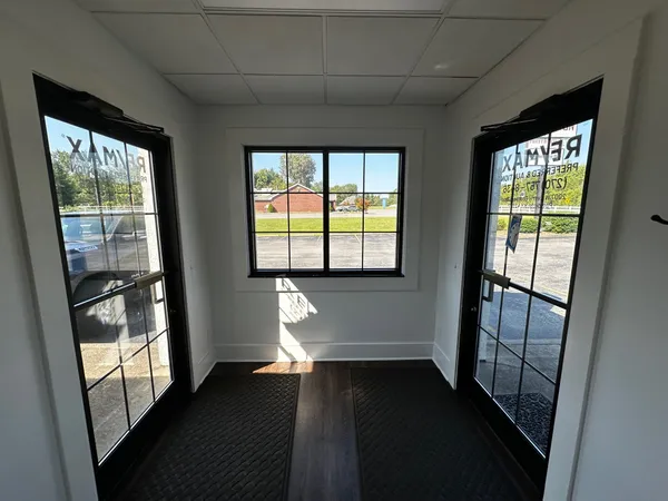 a living room with furniture window and flat screen tv